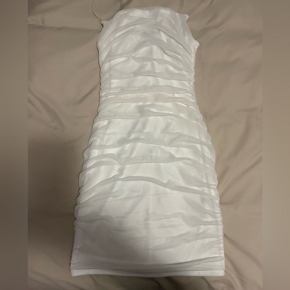 Hi! I’m selling this White ruched bodycon dress from FashionNova